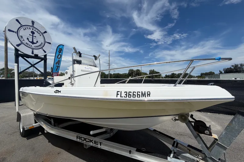 The Image of 2005 Sea Fox 197 Center Console boat on trailer under clear blue sky. - 0
