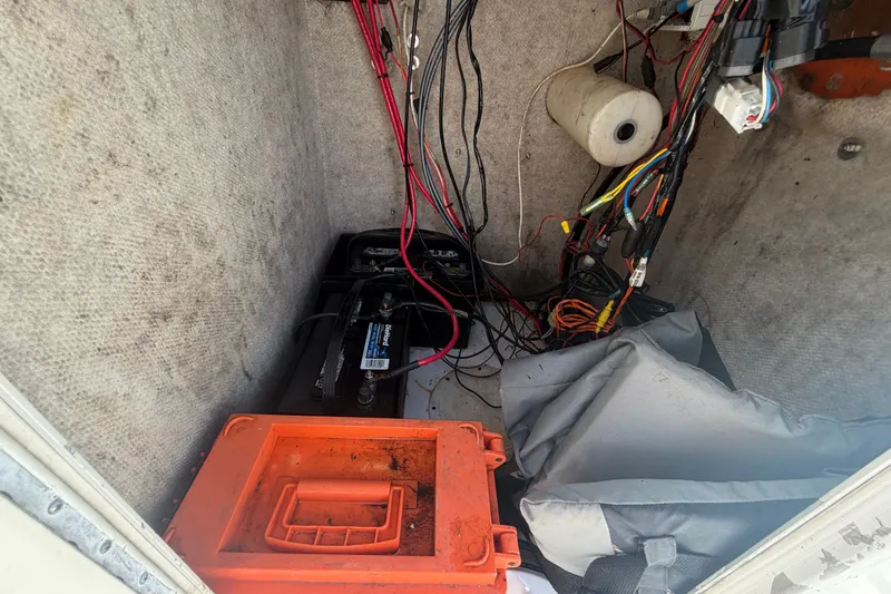 Slide: The Image of Interior view of a 2005 Sea Fox 197 Center Console boat showing wiring and storage. - 24
