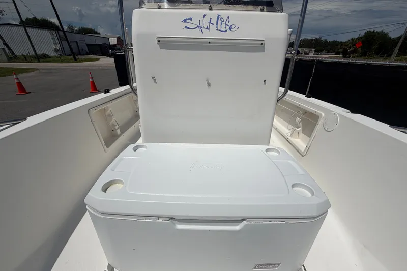 Slide: The Image of 2005 Sea Fox 197 Center Console boat interior with cooler and "Salt Life" decal. - 33