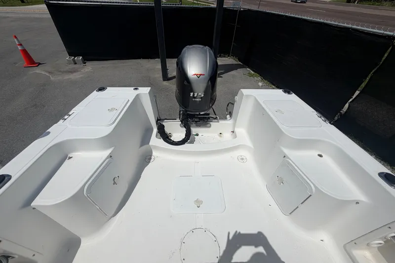 Slide: The Image of 2005 Sea Fox 197 Center Console boat interior with 115 horsepower engine. - 37
