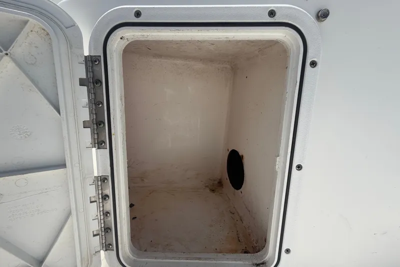 Slide: The Image of Open storage compartment on a 2005 Sea Fox 197 Center Console boat. - 43