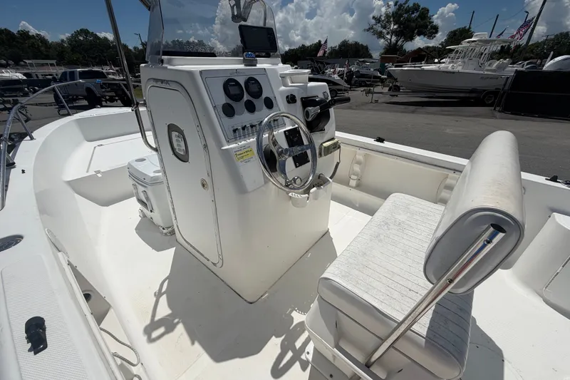 Slide: The Image of 2005 Sea Fox 197 Center Console boat interior with steering wheel and seating. - 14