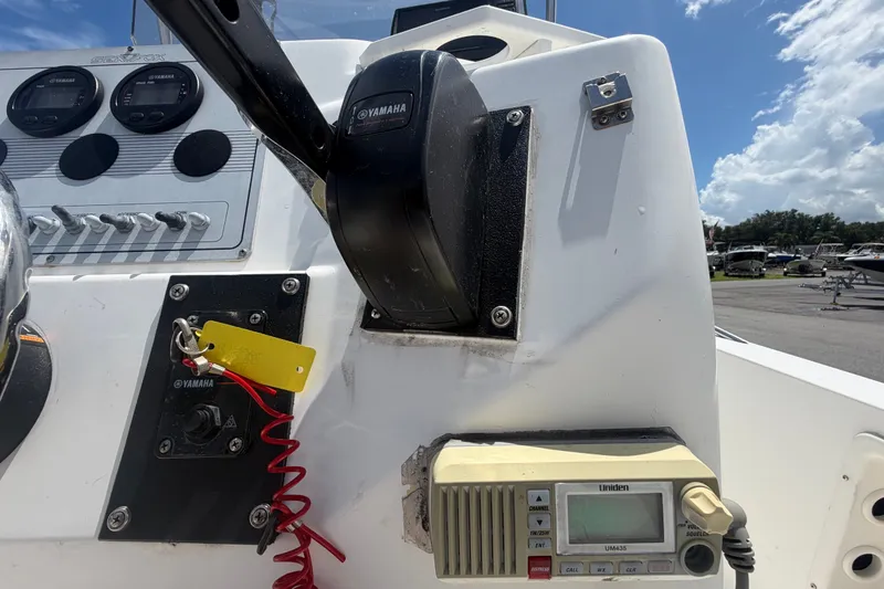 Slide: The Image of Console of a 2005 Sea Fox 197 Center Console boat with Yamaha controls and Uniden radio. - 19