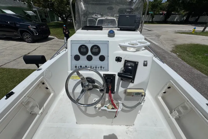 Slide: The Image of 2005 Sea Fox 197 Center Console boat interior with steering wheel and control panel. - 6