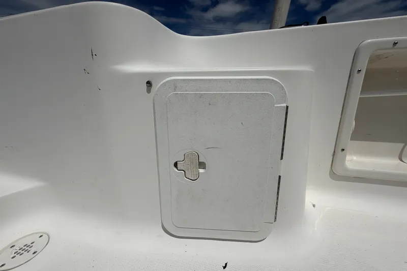Slide: The Image of White storage compartment on a 2005 Sea Fox 197 Center Console boat. - 46