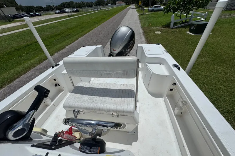 Slide: The Image of 2005 Sea Fox 197 Center Console boat interior with seating and controls. - 11