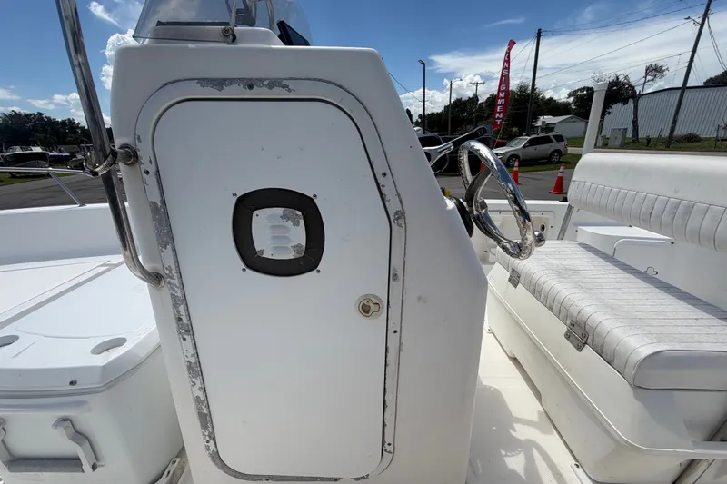 Slide: The Image of 2005 Sea Fox 197 Center Console boat interior with steering wheel and seating. - 21