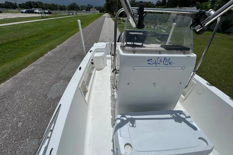 Slide: The Image of 2005 Sea Fox 197 Center Console boat on a paved road, featuring "Salt Life" decal. - 10