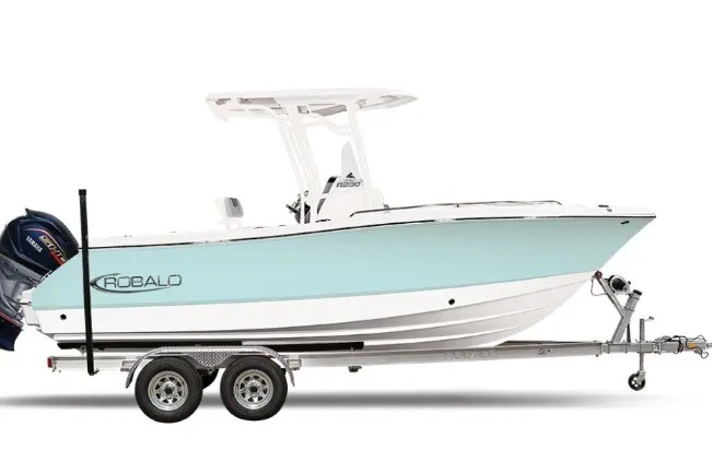 The Image of 2027 Robalo R230 Center Console boat on trailer, side view. - 1