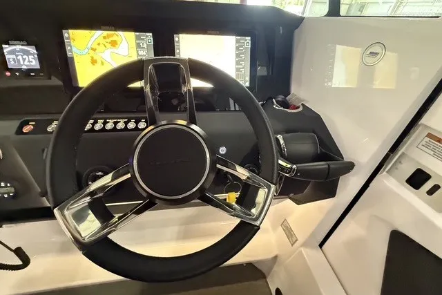 Slide: The Image of Steering wheel and dashboard of 2025 Axopar 29 XC Cross Cabin boat. - 17