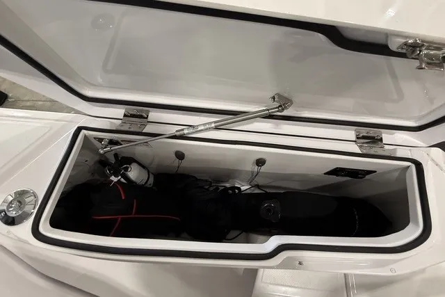 Slide: The Image of Storage compartment of 2025 Axopar 29 XC Cross Cabin, showcasing spacious interior design. - 12