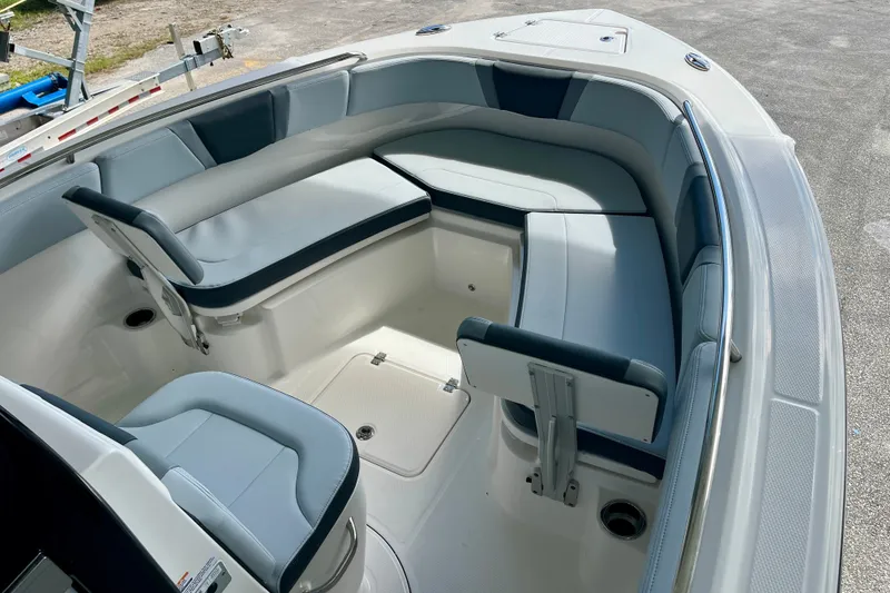 Slide: The Image of 2027 Robalo R230 Center Console boat interior with cushioned seating and sleek design. - 25