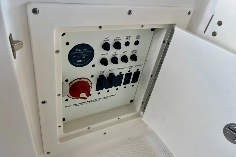 Slide: The Image of Control panel of 2027 Robalo R230 Center Console boat with switches and digital relay. - 34