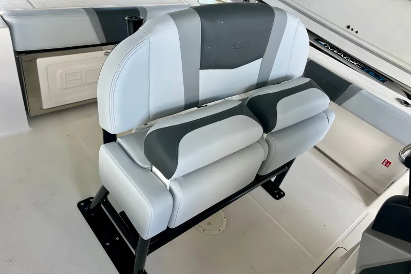 Slide: The Image of 2027 Robalo R230 Center Console boat seating with gray and white upholstery. - 20