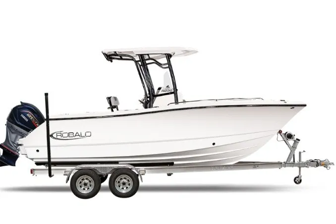 The Image of 2027 Robalo R230 Center Console boat on trailer, side view. - 1