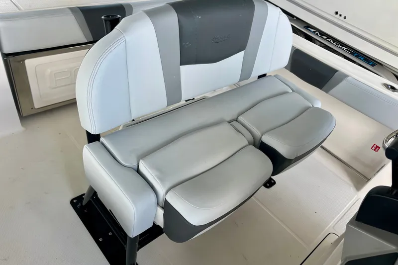 Slide: The Image of 2027 Robalo R230 Center Console boat seating, featuring sleek, cushioned design in a modern interior. - 21