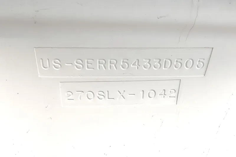 Slide: The Image of 2005 Sea Ray SLX 280 hull identification number and model code embossed on white surface. - 16