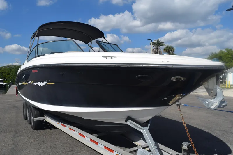 The Image of 2005 Sea Ray SLX 280 boat on trailer under blue sky. - 0