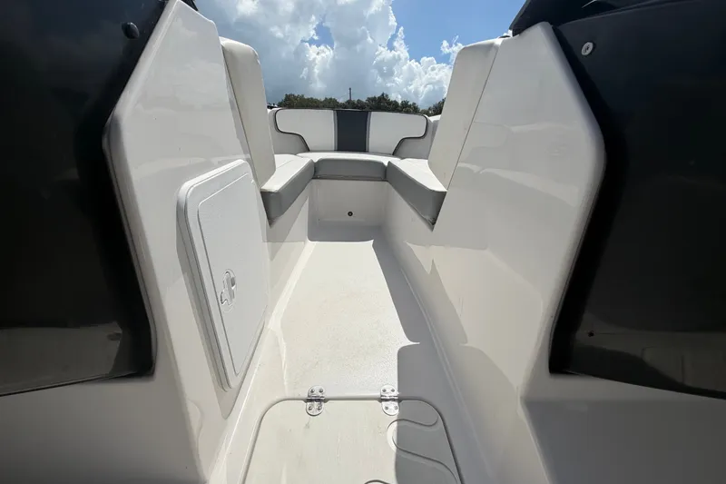 Slide: The Image of Interior view of 2018 Scarab 195 G boat, featuring sleek seating and storage. - 34