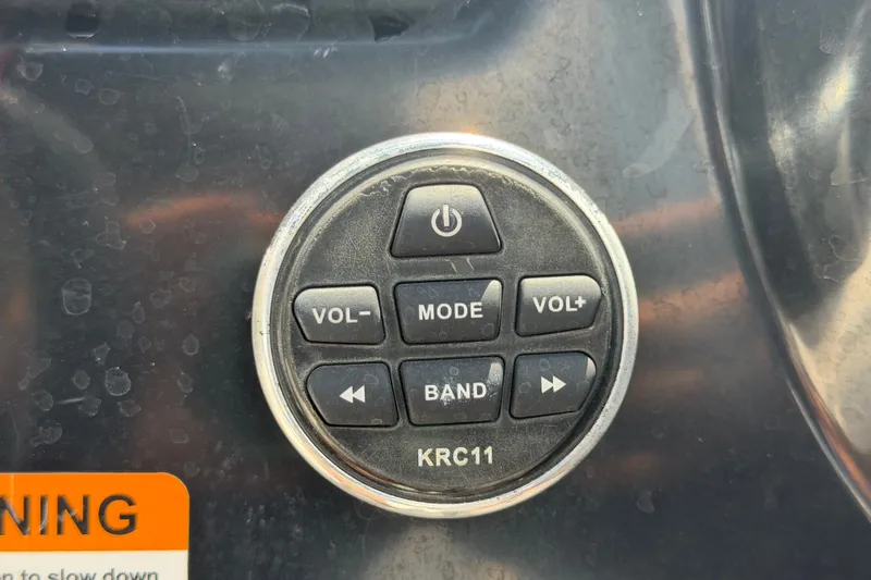 Slide: The Image of Control panel of a 2018 Scarab 195 G boat with volume and mode buttons. - 27