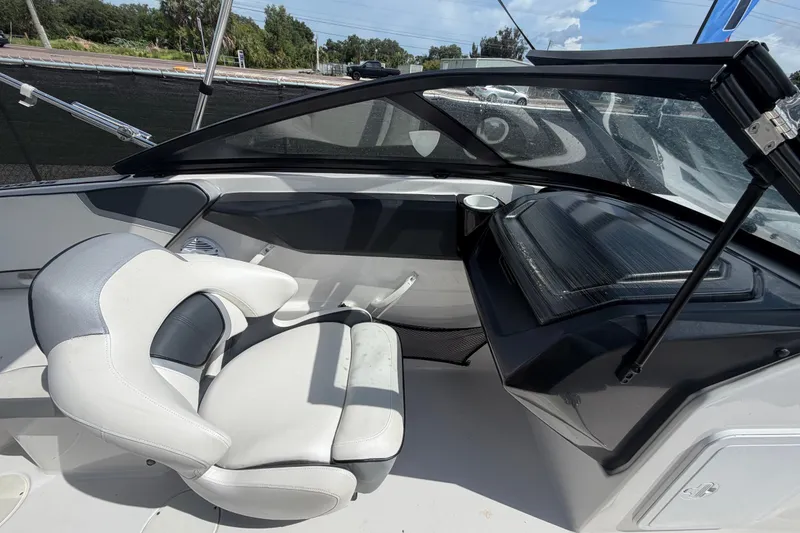 Slide: The Image of Interior of a 2018 Scarab 195 G boat with modern seating and dashboard. - 29