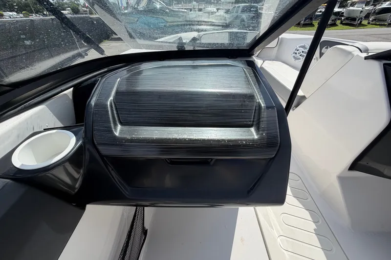 Slide: The Image of 2018 Scarab 195 G boat interior with dashboard and seating area. - 30