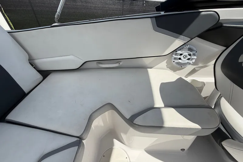 Slide: The Image of Interior seating of a 2018 Scarab 195 G boat with speaker detail. - 54