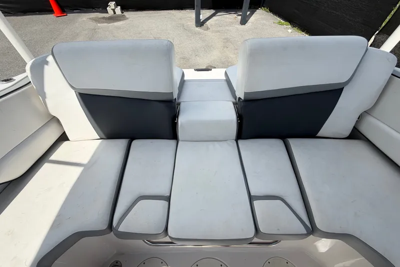 Slide: The Image of 2018 Scarab 195 G boat interior with white and gray seating arrangement. - 51