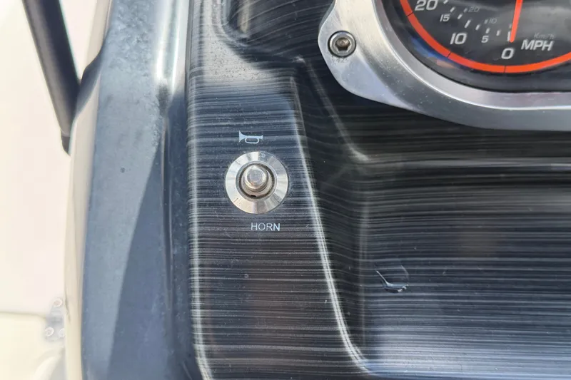 Slide: The Image of Dashboard of 2018 Scarab 195 G with horn button and speedometer. - 25