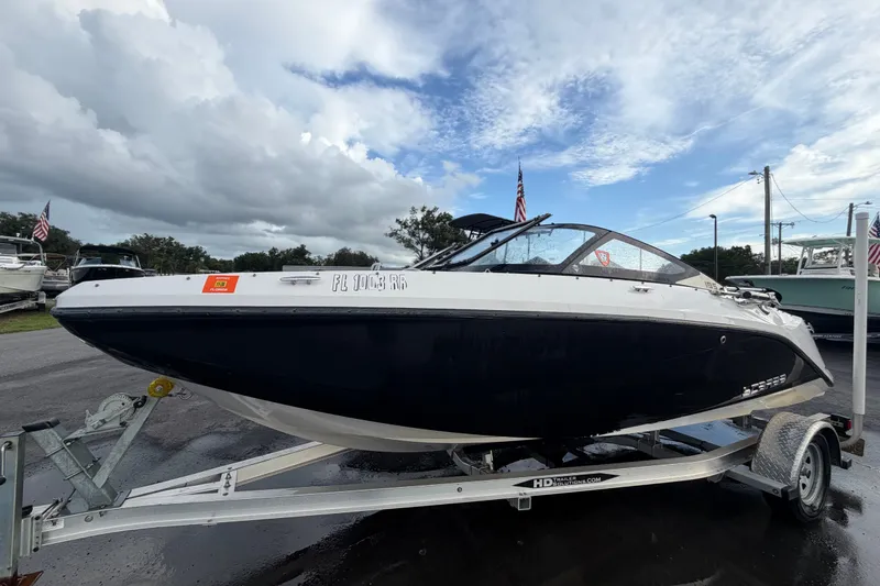 The Image of 2018 Scarab 195 G boat on trailer under cloudy sky. - 0