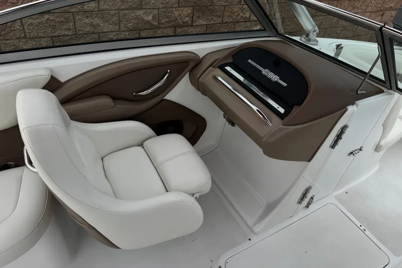 Slide: The Image of Interior of 2012 Cobalt 262 WSS boat with white and brown seating and dashboard. - 35