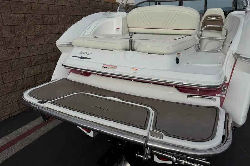 Slide: The Image of 2012 Cobalt 262 WSS boat with swim platform and cushioned seating. - 5