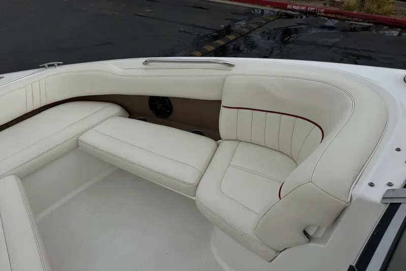 Slide: The Image of Luxurious white seating on a 2012 Cobalt 262 WSS boat, featuring elegant stitching. - 17