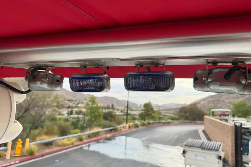 Slide: The Image of Red canopy with mounted lights on a 2012 Cobalt 262 WSS boat. - 21