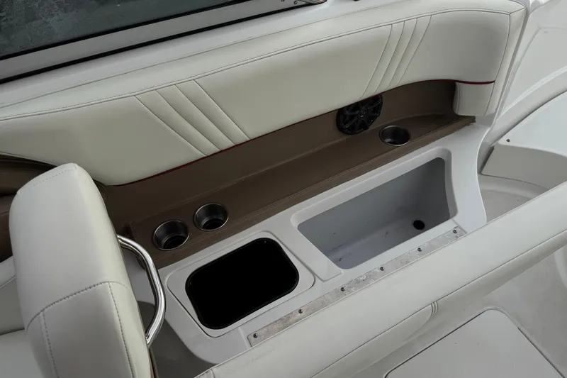 Slide: The Image of Interior of 2012 Cobalt 262 WSS boat with cup holders and storage compartments. - 32