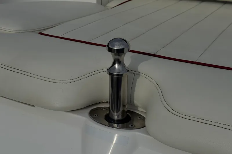Slide: The Image of Stainless steel boat cleat on white leather seat, Cobalt 262 WSS, 2012 model. - 10