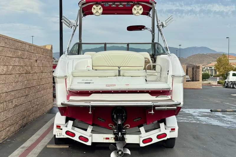 Slide: The Image of 2012 Cobalt 262 WSS boat on trailer, rear view, parked outdoors. - 4