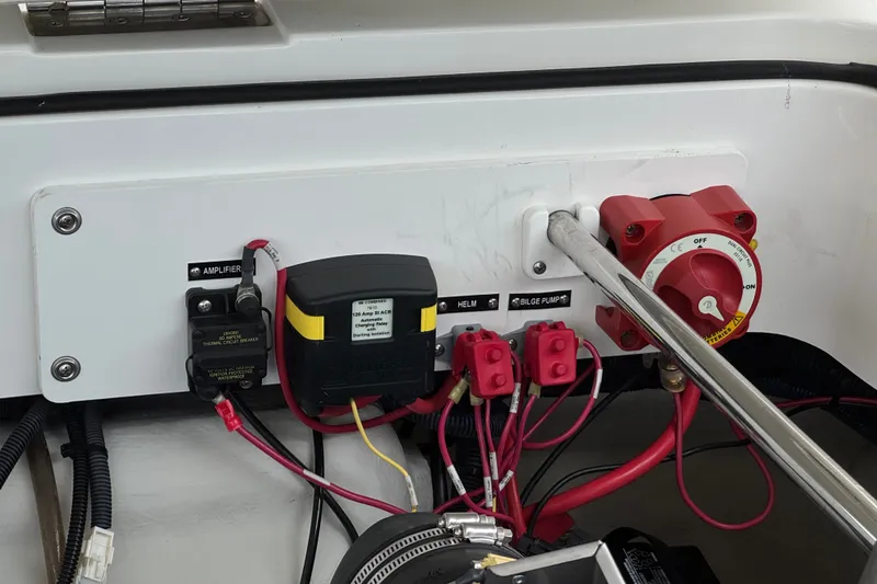 Slide: The Image of Electrical panel of a 2012 Cobalt 262 WSS boat with switches and wiring. - 31