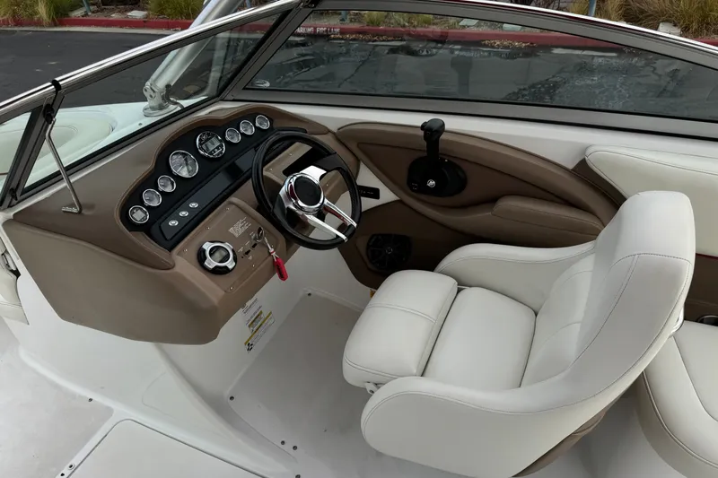 Slide: The Image of Interior of 2012 Cobalt 262 WSS boat with steering wheel and dashboard controls. - 41