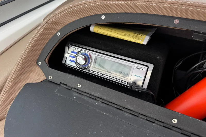 Slide: The Image of Sony marine stereo in 2012 Cobalt 262 WSS boat dashboard compartment. - 36