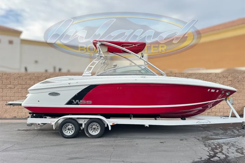 The Image of 2012 Cobalt 262 WSS boat in red and white on a trailer. - 0