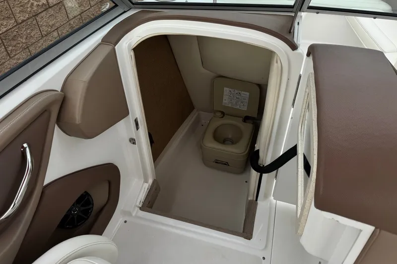 Slide: The Image of Interior view of a 2012 Cobalt 262 WSS boat's compact restroom area. - 37