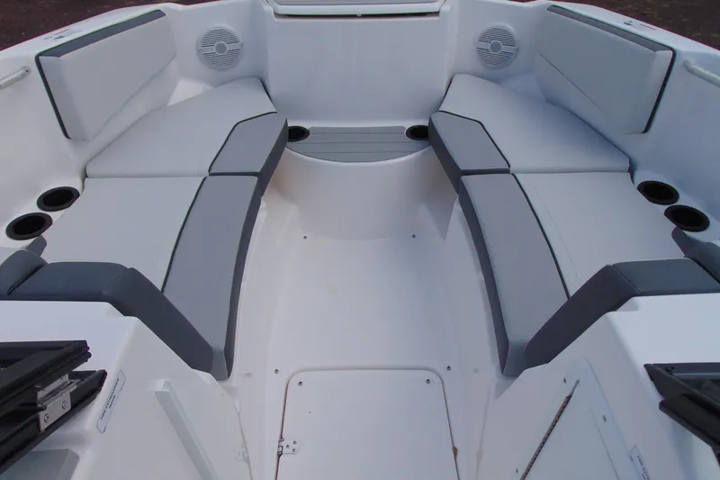Slide: The Image of 2026 Yamaha Boats SX220 interior with spacious seating and cup holders. - 12
