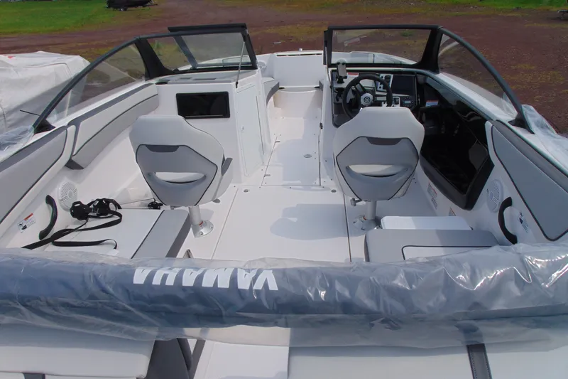 Slide: The Image of 2026 Yamaha Boats SX220 interior with dual captain's chairs and sleek dashboard design. - 6