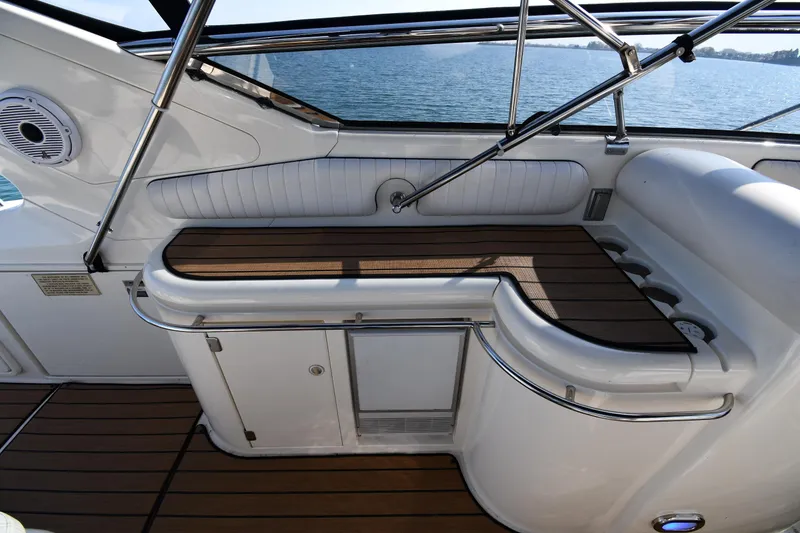 Slide: The Image of Sunseeker 55 CAMARGUE 1996 yacht interior with wooden deck and seating area. - 30