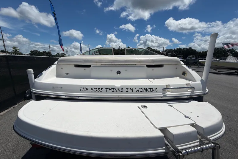 Slide: The Image of 2003 Chaparral 183 SS boat with humorous text, "The Boss Thinks I'm Working," on the stern. - 3