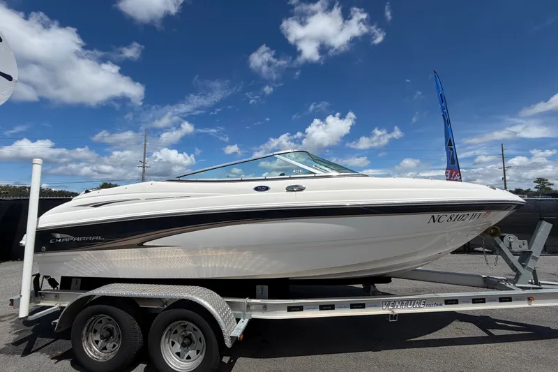 Slide: The Image of 2003 Chaparral 183 SS boat on trailer under blue sky with clouds. - 1