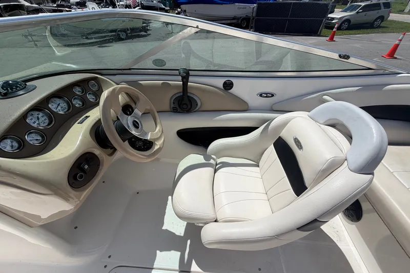 Slide: The Image of Interior of a 2003 Chaparral 183 SS boat with steering wheel and gauges. - 18