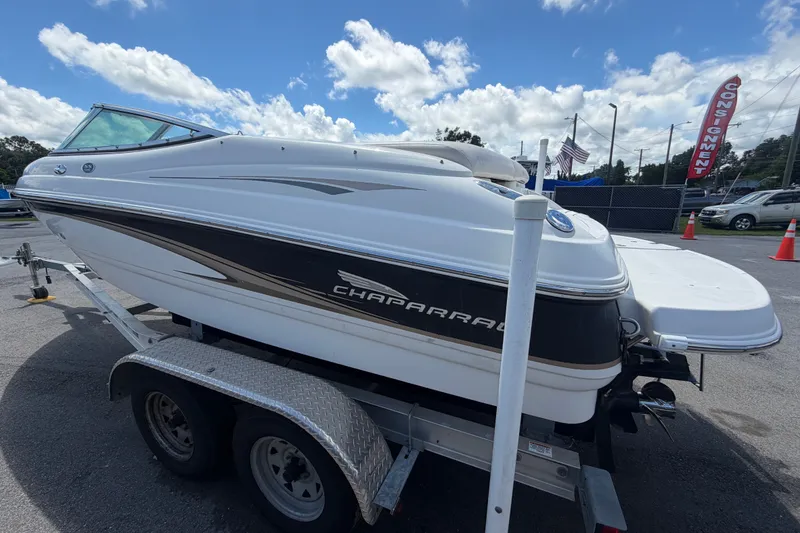 Slide: The Image of 2003 Chaparral 183 SS boat on trailer under a partly cloudy sky. - 6