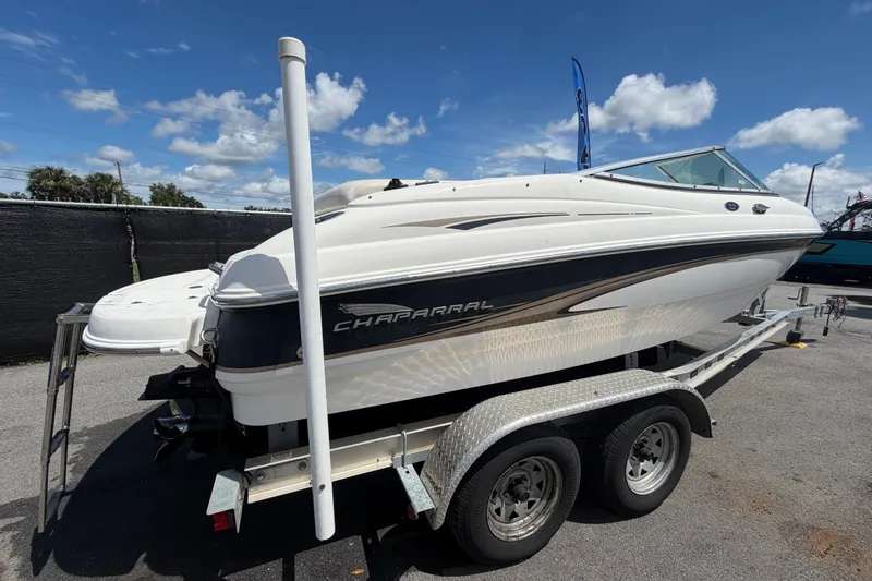 Slide: The Image of 2003 Chaparral 183 SS boat on trailer under a clear blue sky. - 2